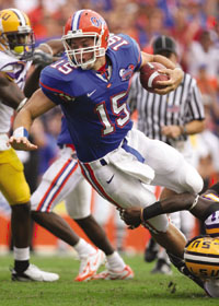 Tim Tebow runs with the ball